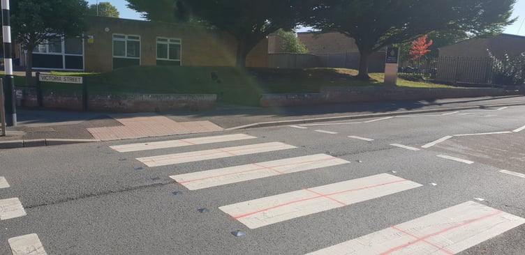 The cross of St George painted on a pedestrian crossing in North Street, Wellington.