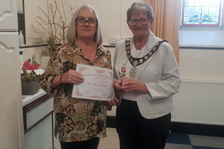 Maxine Price collects the business award on behalf of Nook and Cranny from Wellington Mayor Cllr Janet Lloyd during the town council's annual community awards presentations.