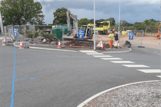 Contractors putting right the junction lay-out by the Lidl supermarket entrance, which will allow the Wellington railway station access road to be built