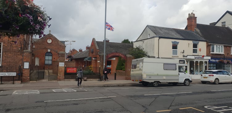 Councillors in Wellington are to discuss issuing a 'position statement' on the raising of flags such as this one in High Street at the entrance to Lancer Court.