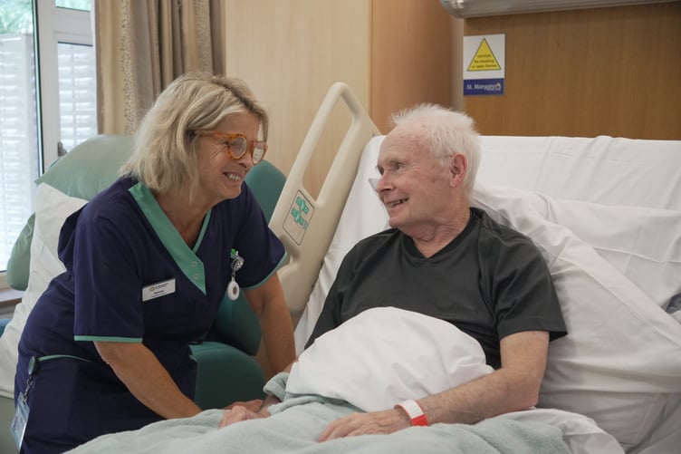 A St Margaret's nurse with a patient in the charity's Taunton centre.