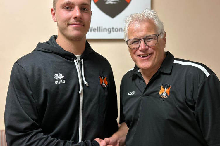 Central defender Jake Haggerty was Wellington’s man-of-the-match against Penzance and he is pictured with club chairman and interim manager Mike Hall. The game was sponsored by C&C Carpets, Curtains, Beds & Blinds.  