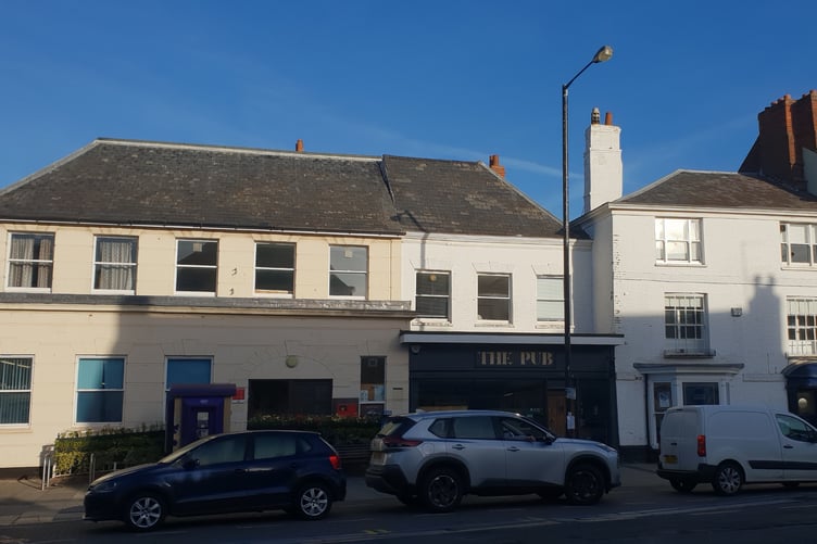 A Cross of St George flag had been flying throughout September from this lamppost outside the former The Pub, in High Street, Wellington.