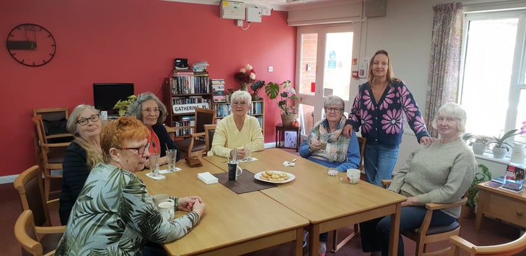 Senior house manager Rebecca South (standing) with Abbeyfield Wellington Old Vicarage residents attending a coffee morning.
