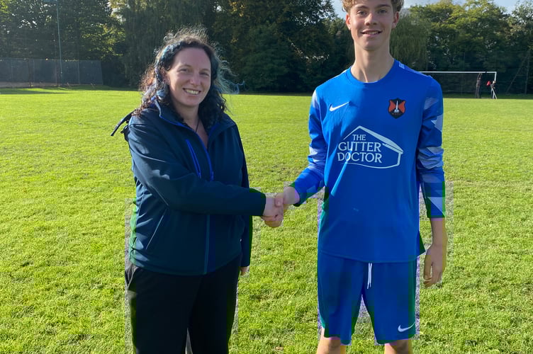 Amy Alderman from Hair by Alderman, who sponsored the game, with Player of the Match George B