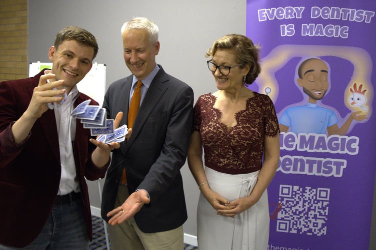 Liberal Democrat MP for Taunton and Wellington Gideon Amos is pictured at the launch of the 'Magic Dentist' initiative with Nicki Rowland from the charity and magician Callum Weaver