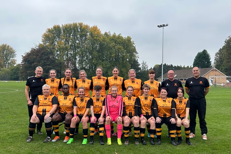 Wellington Wildcats, back left to right: Geoff Hamlyn, Leah Morrell, Robyn Stockman, Tenika Goss, Grace Winter (Captain), Imogen Edmondston-Low, Tash Hole, Charlotte Ayers, Les Coates, Steve Crudge; front: Kelly Dinning, Nyima Touray, Milly Howe, Jess Regan, Bianca Hamlyn, Georgia Purdy, Grayson Kennard, Keeley Coates, Emily Ayers.  