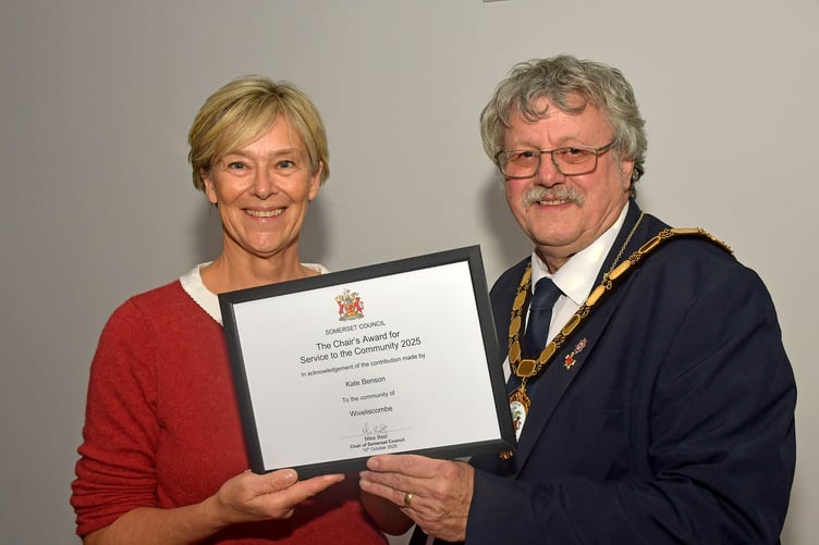 Kate Benson of Wivey Kitchen receiving her award from Somerset Council Chair Cllr Mike Best