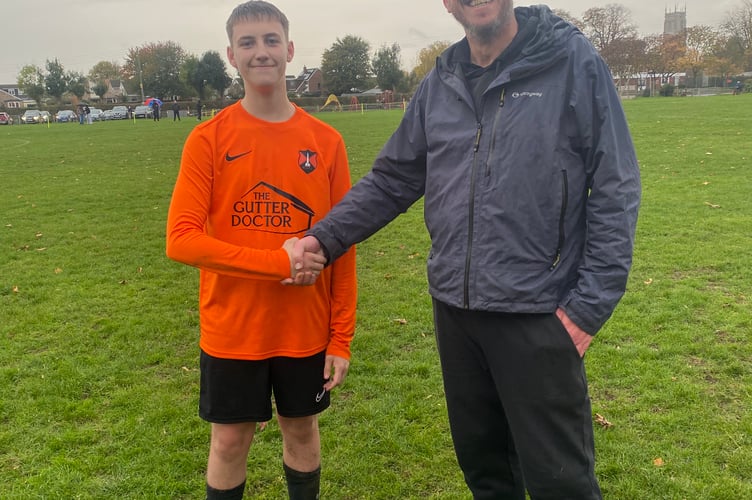 Wellington's Player of the Match Alfie P with U15 coach Geoff Mold