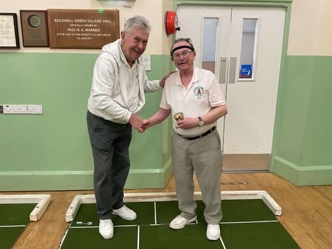 Mike Russell (left) welcomes Mike Bull to Rockwell Green Shortmat Bowls Club
