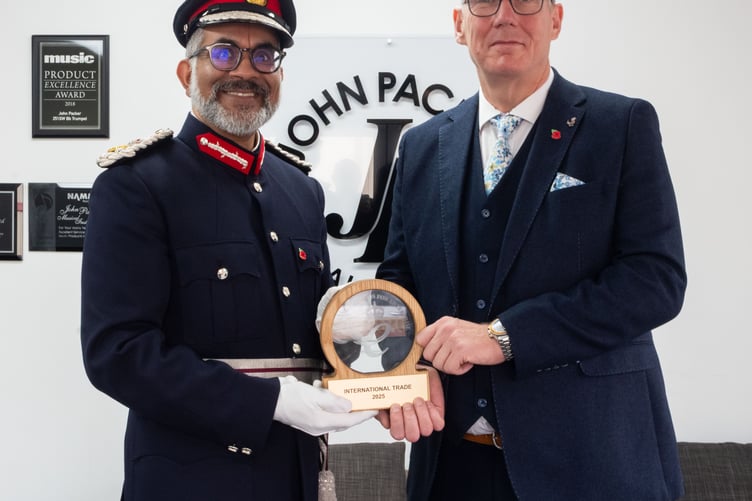 Lord-Lieutenant of Somerset Mohammed Saddiq with managing director Rob Hanson during his visit to John Packer Musical Instruments.