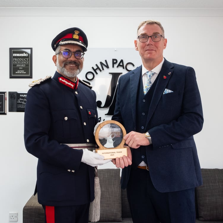 Lord-Lieutenant of Somerset Mohammed Saddiq with managing director Rob Hanson during his visit to John Packer Musical Instruments.