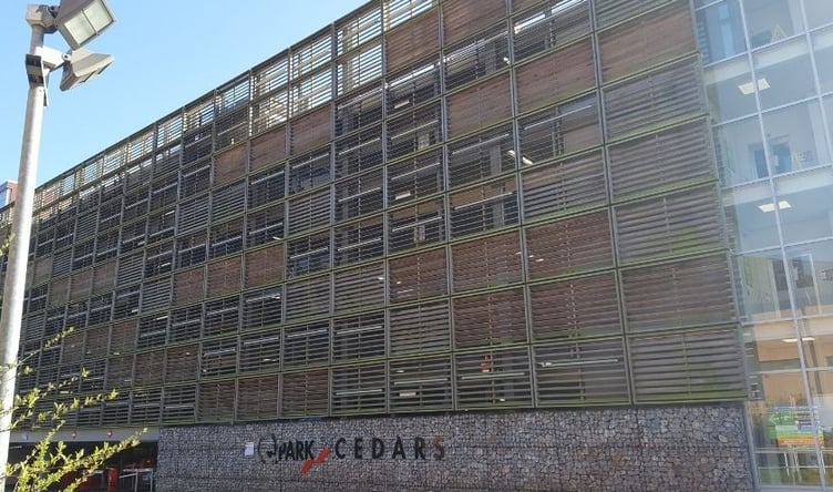 Musgrove Park Hospital's multi-storey car park has been closed after a car smashed into a wall on the first floor of the building.