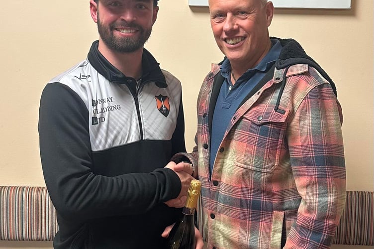Player of the Match Jack Bryant (left) with Simon Richards, organiser of Rockwell Green/Cottage reunion who sponsored the game.