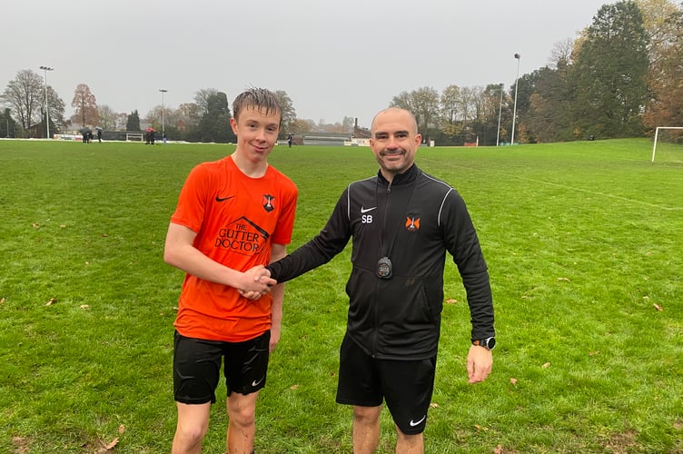 Wellington's Player of the Match Ryan M with Under 15 coach Scott Bates