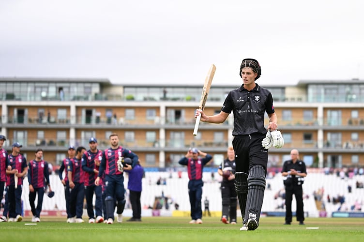 Archie Vaughan leaves the field after scoring his maiden century for Somerset against Northants