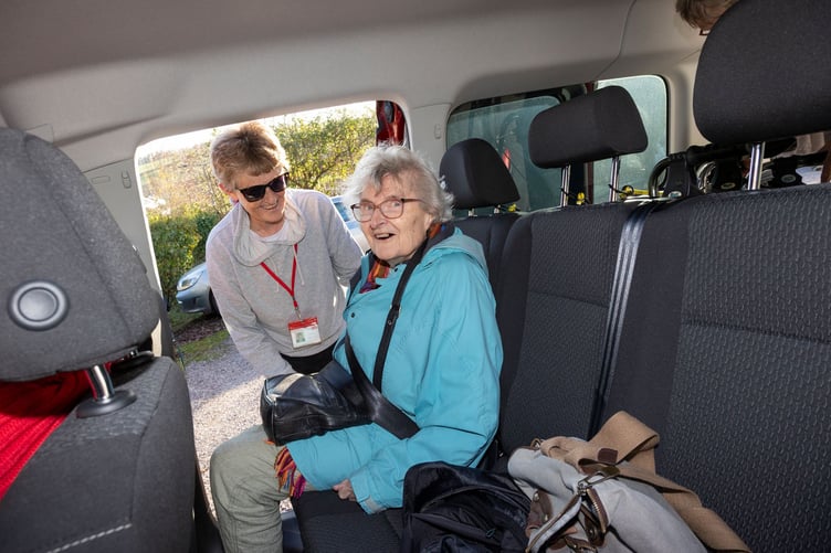 Wivey Link passenger Beryl Lovell is safely seated by volunteer driver Christine Brooker.