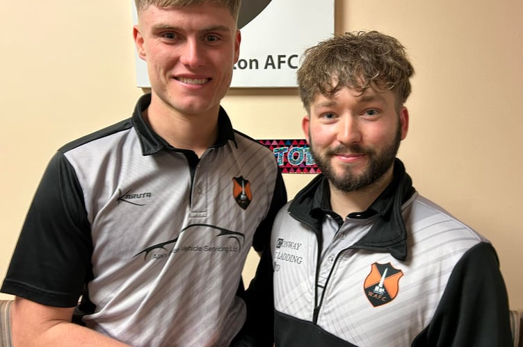 Player of the match Wes Poulsom (right) with keeper Charlie Hawkings representing sponsor JH Total Construction.