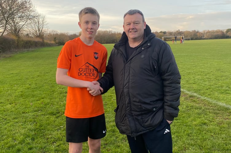 Player of the Match Ryan M with coach John Knox
