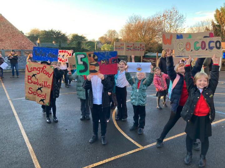 Langford Budville Primary School pupils welcome the Moorland Federation cyclists.