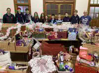 Pupils deliver 50 Christmas hampers to local families