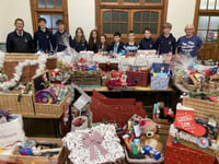 Pupils deliver 50 Christmas hampers to local families