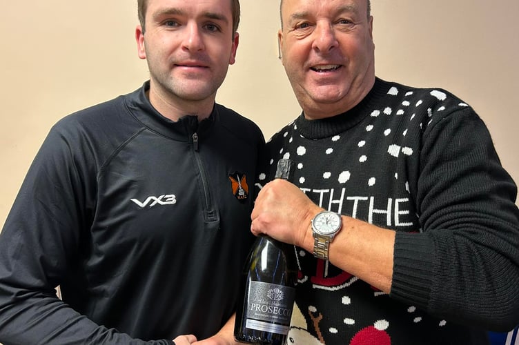 Defender Mark Cornish was Wellington's Player of the Match and is pictured with supporter Phil Conn who sponsored the match.