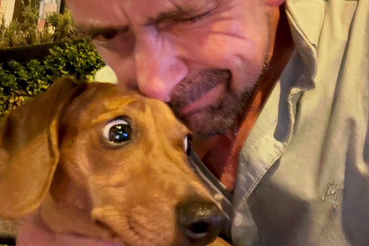 Stephen James and Molly the one-year-old dachshund.