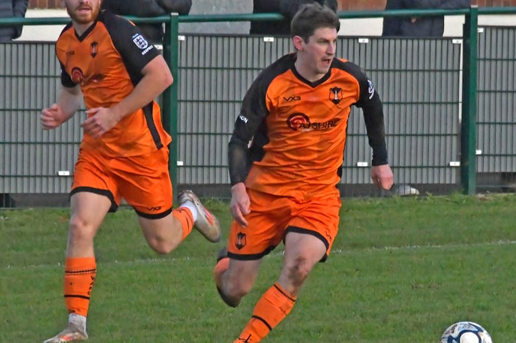 Alfie Slough and Josh Baker in action for Wellington in a recent home match against highfliers Clevedon Town. 