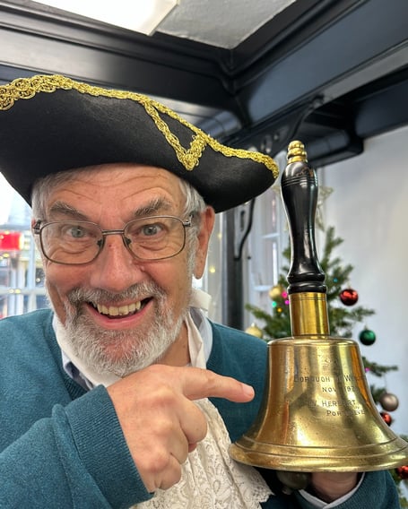 Wellington Town Crier Andrew Norris with his century-old bell.