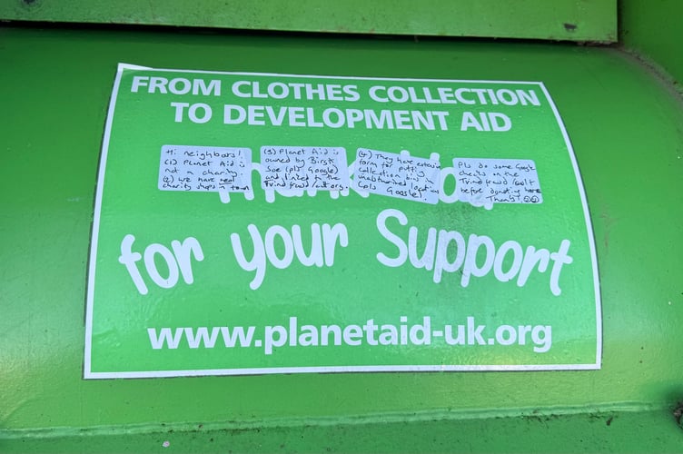 Someone has left a note on the Planet Aid clothing bin advising them against using the facility.