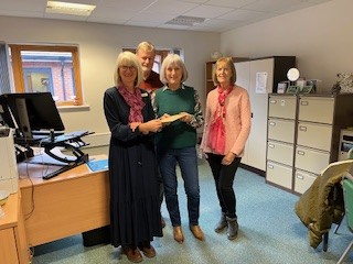 Lydia, Veronica Tatnall (Chair), Janet Govier (Fundraising/Social Secretary) behind John Cutting (Deputy Chair).