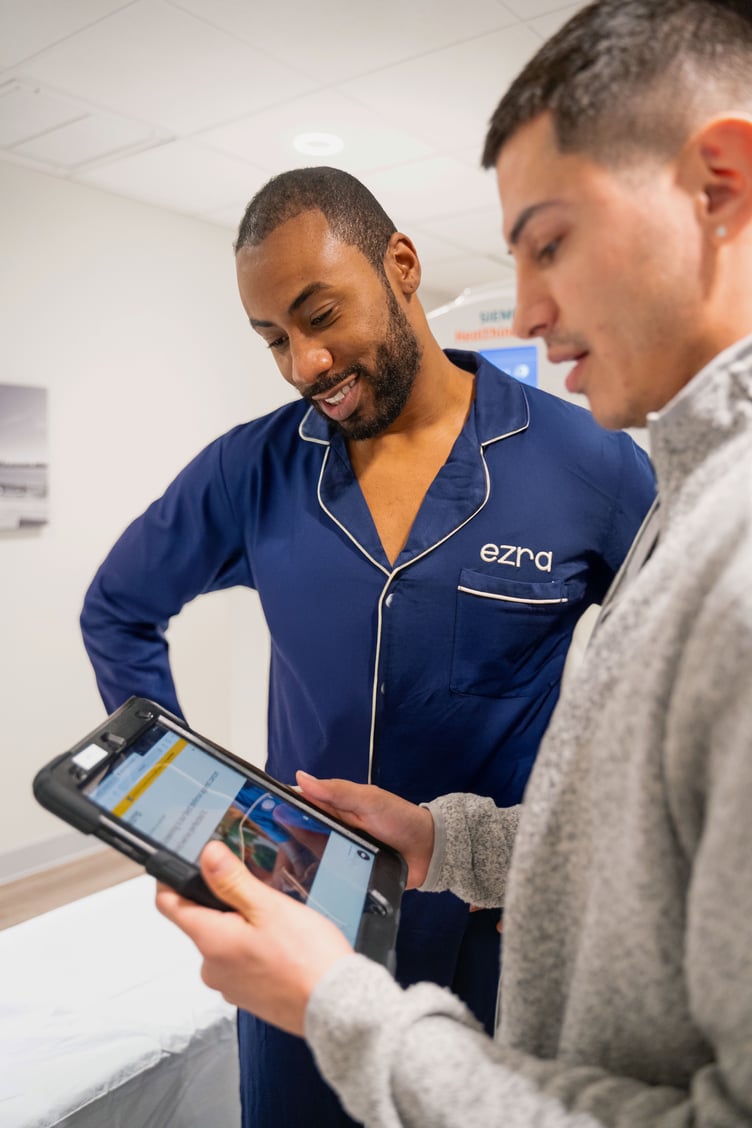 Medics review scans produced by a new AI supported MRI scanner in Taunton.