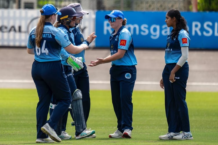 Parramatta team mates congratulate Chloe on another wicket