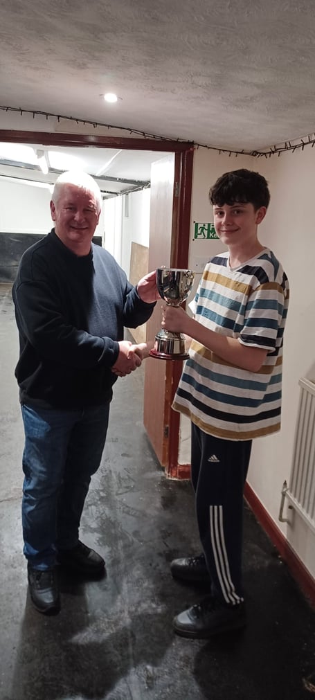 Mowers' captain Mike Jarman is presented with the Ken Bright Cup by Harrison Bright