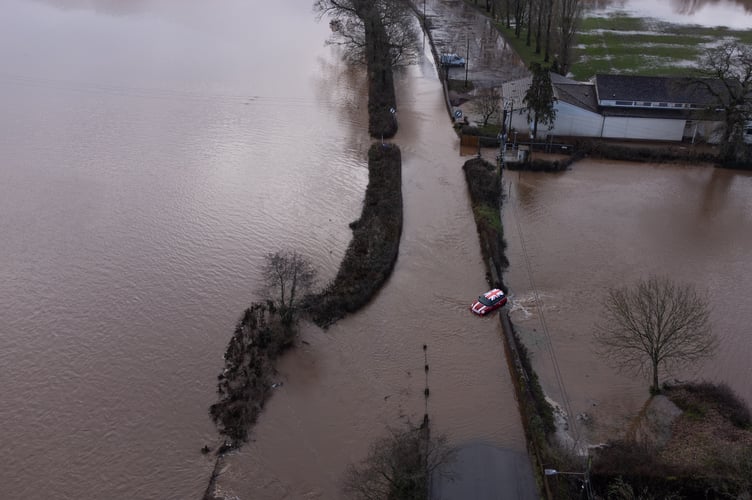 A car stuck in flood water.