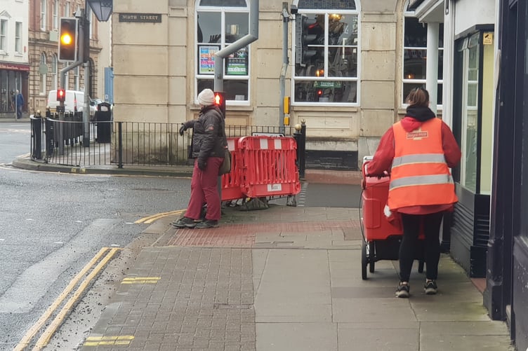An apparently rare sight in Wellington these days - a postal worker delivering post.