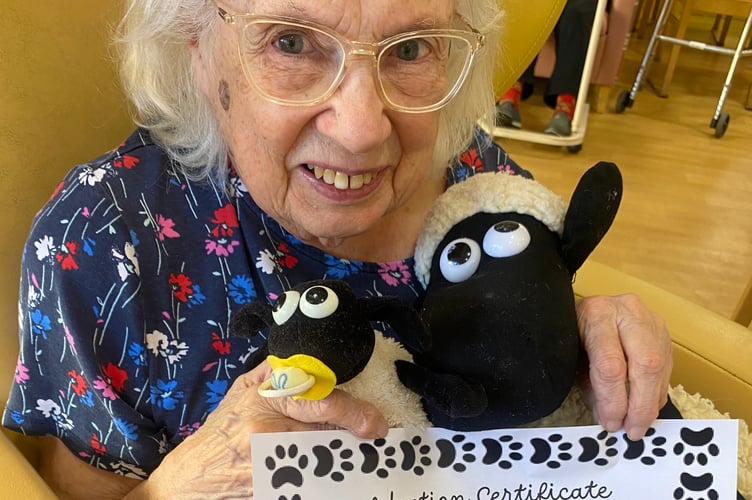 Barry the lamb and Barbara Staple at the mass animal adoption.