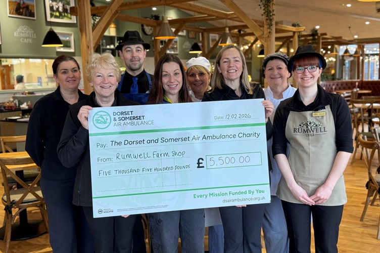 Members of the Rumwell Farm Shop team including Partners in the business, Anne Mitchell and Sophie Mitchell (holding cheque) presenting the cheque to Charlotte Humber, Supporter Engagement Officer for Somerset from DSAA (centre).