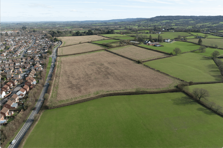 A drone image of fields outside Wellington on which Pegasus Group wants to build 250 houses, with Middle Green Farm seen to the right.