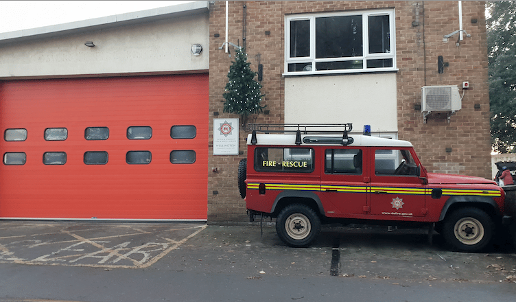 A developer wants to build a terrace of three houses on a car park behind Wellington Fire Station.