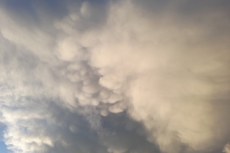Reader Dave Hellyer supplied this image, adding that it 'looked like a couple chatting in clouds above South Street, Wellington'