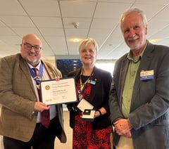 Retired headteacher surprised with top award