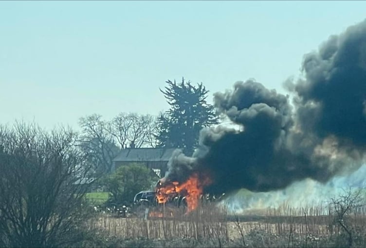 A tractor and a field of elephant grass near Bishops Lydeard were destroyed in this blaze attended by firefighters from Wellington.