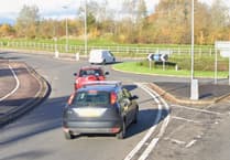 Giant flower planter shape of Wellington Monument to mark approach to town