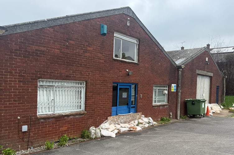 The property in The Blackdown business park is barricaded with sandbags to prevent flooding