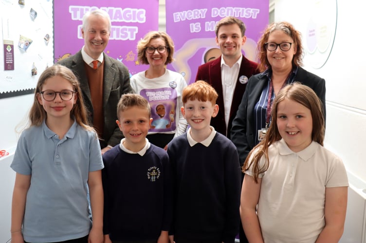 Rear from left, Gideon Amos, Nicki Rowland, Callum Weaver and Lisa Eadie. Front, Holy Trinity pupils Florence, Max, Barnaby and Myla