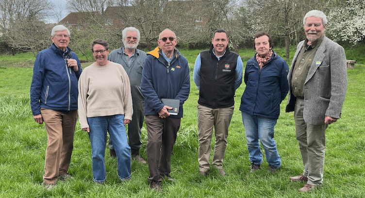 Wellington Town Council open spaces manager Darren Hill (third, right) with this year's Green Flag judge and volunteers who look after the Swains nature reserve.