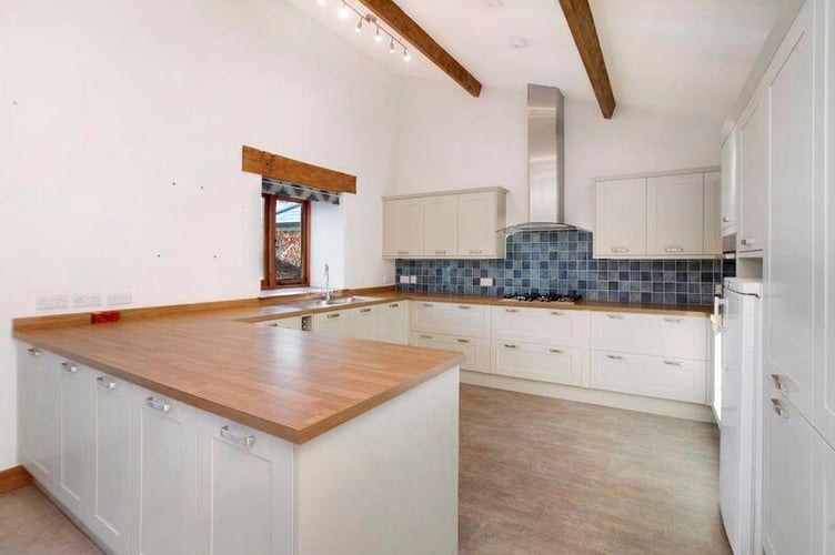 Grade II Listed detached barn has a spacious kitchen