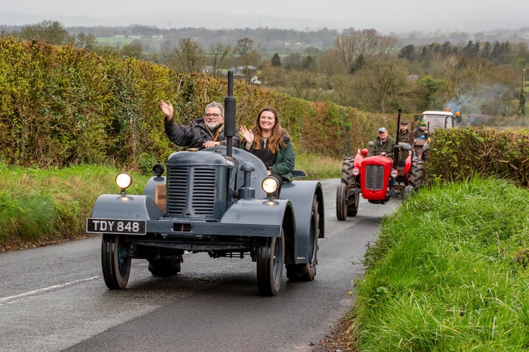 The procession waved to the crowds that formed to support the Culm Valley Single Cylinder Vintage Tractor run on Good Friday